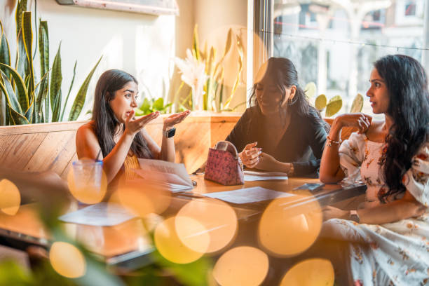 istock Diverse Female Friends Enjoying Drinks at a Bar 2178862231