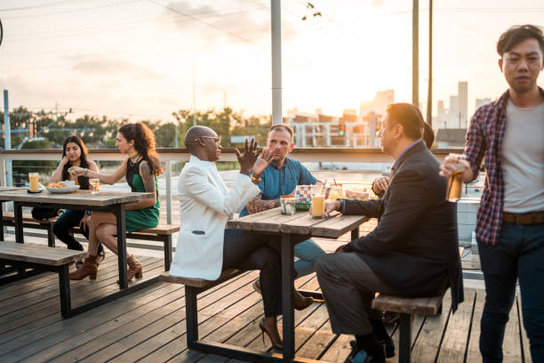 istock Diverse Group Gathering for Dinner on Outdoor Terrace 2178862283