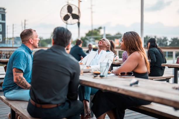 istock Diverse Friends Enjoying Evening at Outdoor Eatery 2178862299