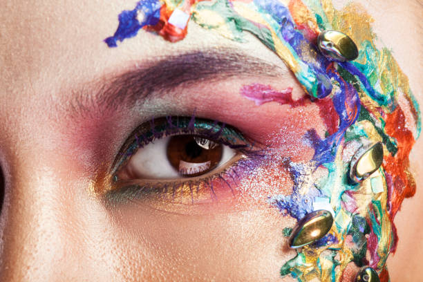 istock Beautiful young woman with creative makeup on her face 2178862681