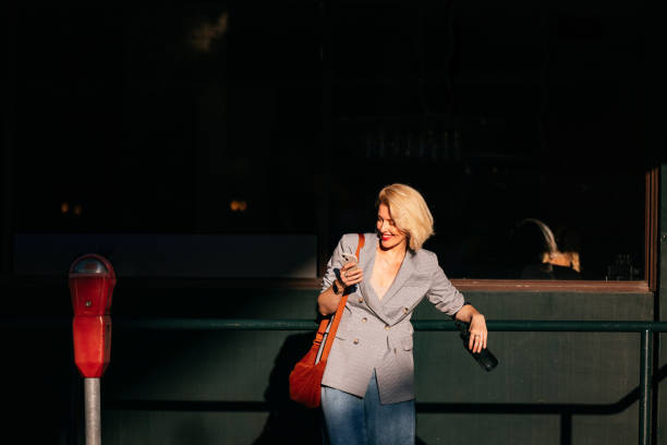 istock Stylish Woman in Urban Setting Using Smartphone 2178862882