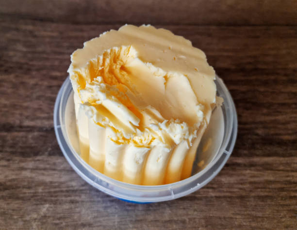 Whole block butter on wooden background
