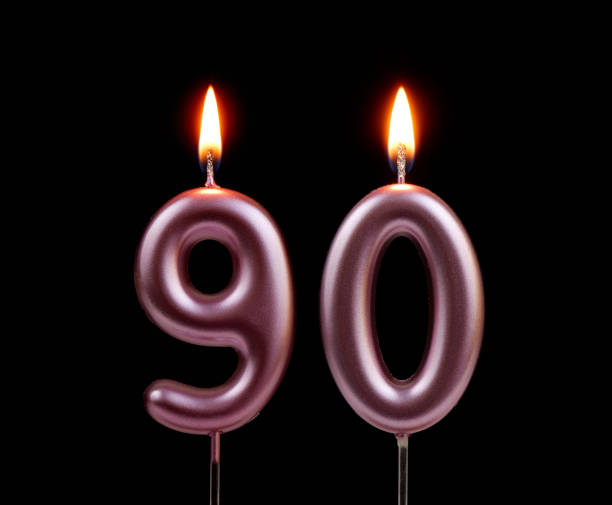 istock Pink birthday candles isolated on black background, number 90 2178864451