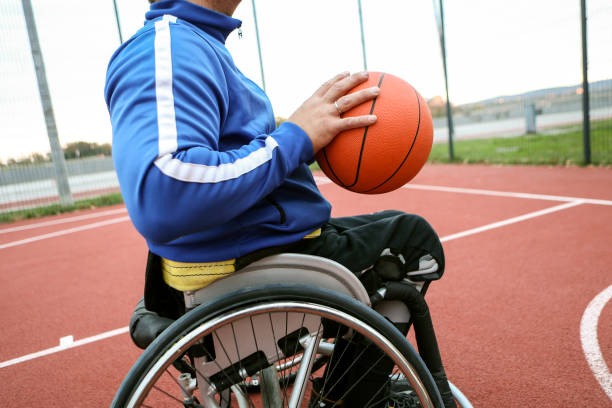 istock Man in a wheelchair playing basketball 2178865943
