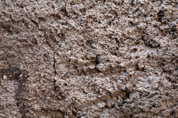 istock Grey concrete surface. exterior cement wall with small stones. Background, Wallpaper textured picture. top view. Nobody. Copy and test space. Aged wall pattern. Construction work 2178866165