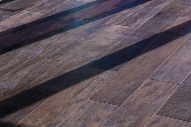 istock Elegant Wooden Floor With Intricate Grain Patterns Casting Long Shadows During the Golden Hour 2178868257