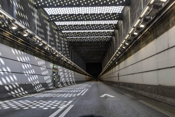 High-speed road tunnel view from a fast-moving car. Road and railway tunnel and blidge connecting Denmark and Sweden.