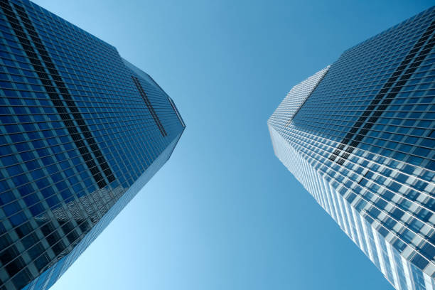 Low angle view of the Shanghai International Finance Center, a commercial building complex and a shopping center in Lujiazui, Pudong, Shanghai, China. It incorporates two tower blocks at 249.9 metres (south tower) and 259.9 metres (north tower).