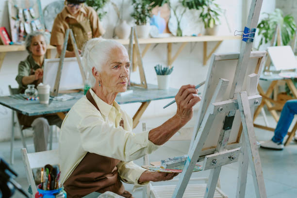 istock Woman Focused on Painting 2178884003