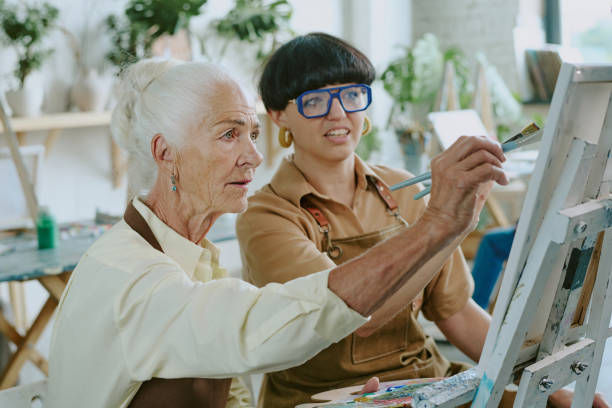 istock Mature Drawing Teacher Helping Senior Student 2178884057