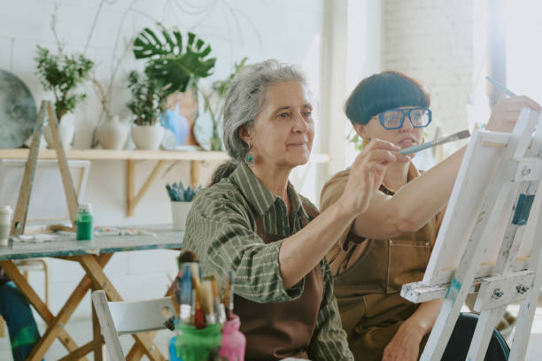 istock Retired Woman Drawing with Her Teacher 2178884409