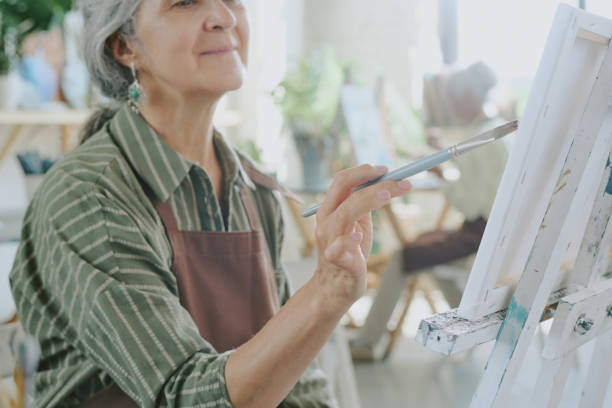 istock Female Hand Holding Paintbrush 2178884455