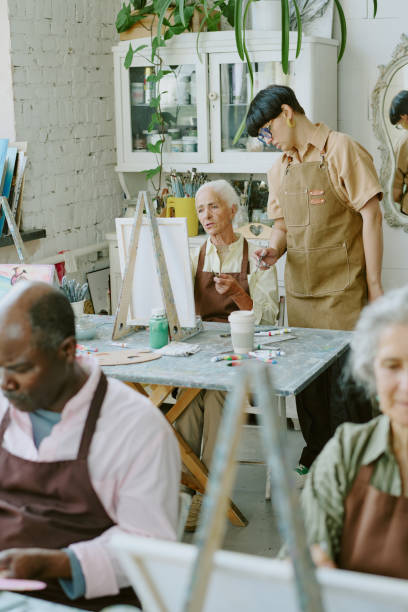 istock Young Adult Drawing Teacher Checking Senior Student 2178884614