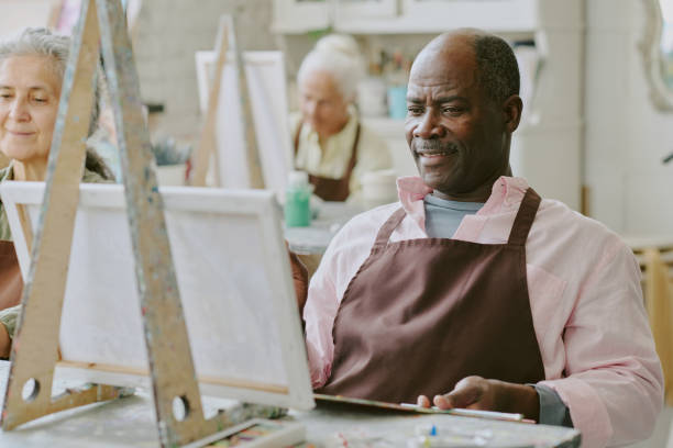 istock Smiling African American Man Visiting Art Session 2178885924
