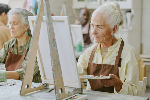 istock Woman Painting on Canvas 2178885936