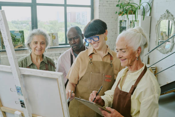 istock Group of Students Looking at Painting 2178886162