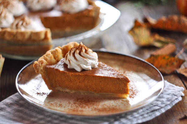 istock Traditional pumpkin pie topped with whipped cream. Selective focus. 2178888774