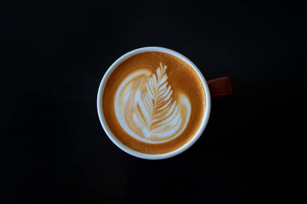 istock Directly above view a cup of coffee latte on a black background 2178890292