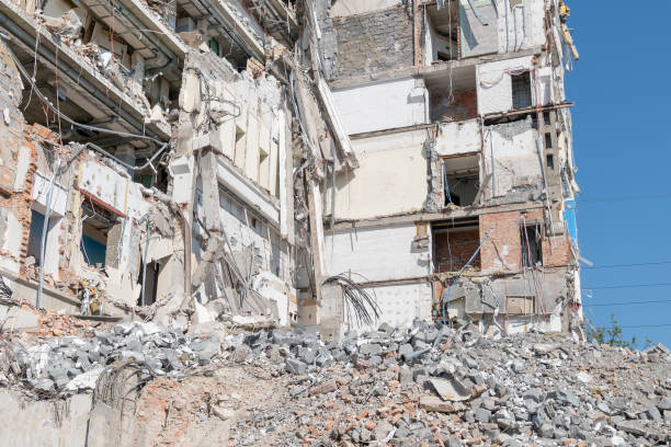 Demolition of a building. The wreckage of a demolished building.