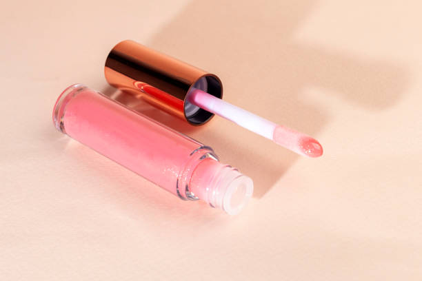 istock Lip gloss with applicator in light tubes. Cosmetic accessories. Copy space 2178896652