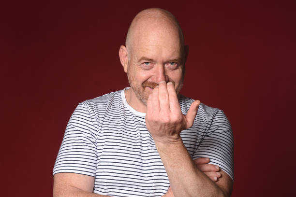 istock portraits of a ma on red background 2178900664