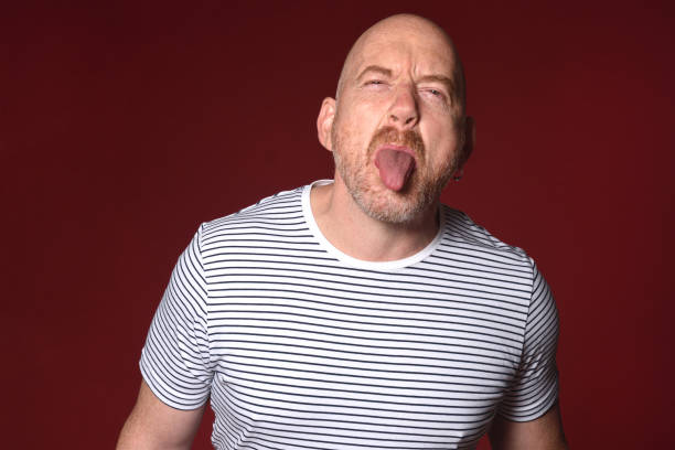 istock portraits of a ma on red background 2178900772