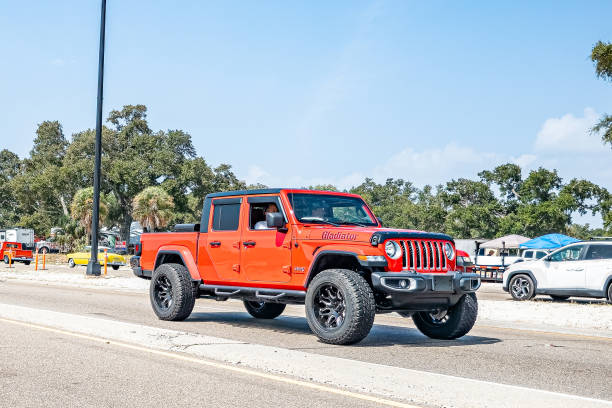 Gulfport, MS - October 04, 2023: Wide angle front corner view of a 2020 Jeep Gladiator Sport 4x4 at a local car show.