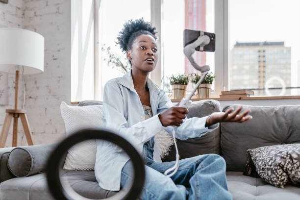istock Confident Black Woman Vlogging with Smartphone at Home 2178902713