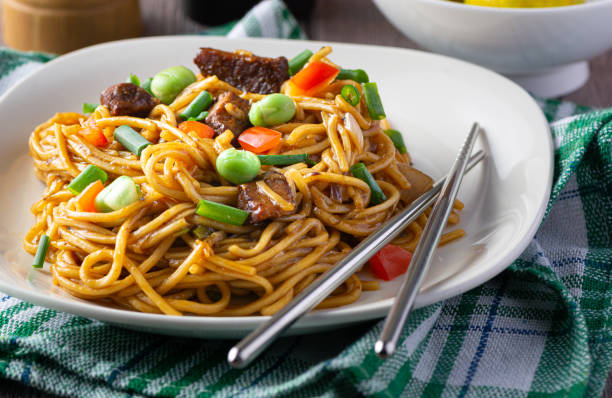 istock spaghetti mixed with vegetable sauce and beef  chopsticks 2178909957