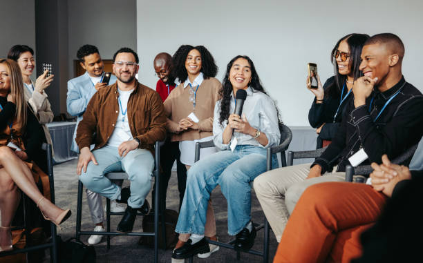 istock Young entrepreneurs sharing success stories at a group discussion event 2178912636