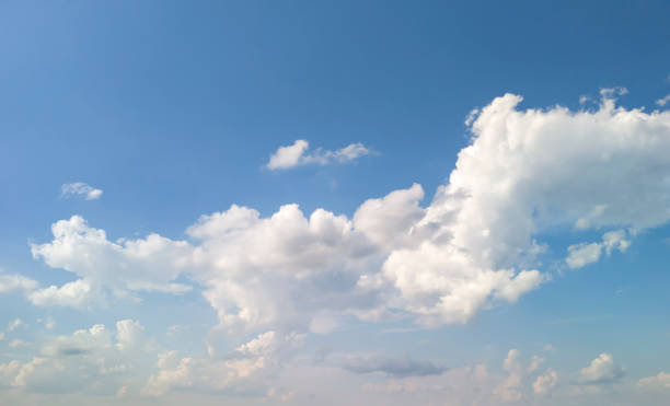 istock A clear blue sky with fluffy white clouds, perfect for nature themes or backgrounds. Ideal for relaxation, travel, and seasonal imagery. 2178923925