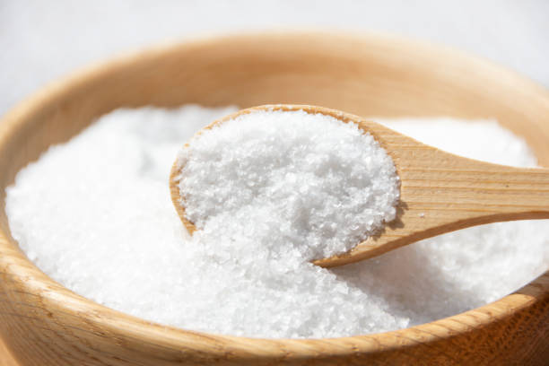 istock Salt in a wooden spoon close-up. 2178924094