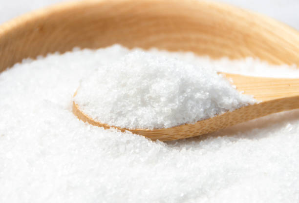 istock Salt in a wooden spoon close-up. 2178924124