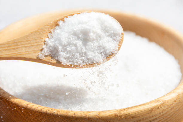 istock Salt in a wooden spoon close-up. 2178924152