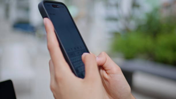 istock Woman hands texting smartphone outdoors closeup. Unknown lady fingers typing sms 2178925859