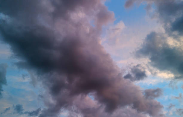 istock Colorful clouds drifting across a clear sky at dusk, creating a serene backdrop for nature lovers and photographers. 2178925940