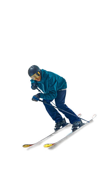 istock Skier mid-run, leaning into action with determined look, showcasing thrill and technical skill required for sport against white studio background. 2178930148