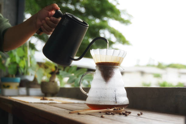 istock Drip coffee is a method of brewing pour-over or filter brewers in which the method of brewing coffee without a brewer is simply using water through coffee grounds and a filter (paper filter) 2178930328