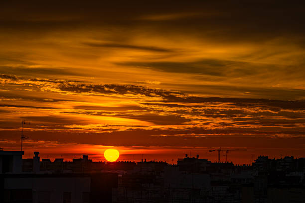 Dramatic red sky over Valencia city at sunrise