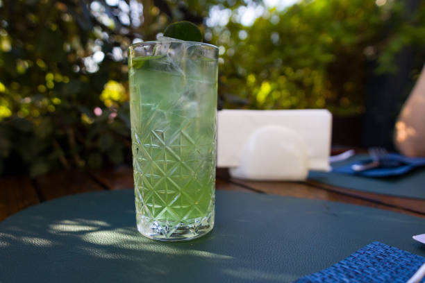 istock green mojito in a glass on a stand in a restaurant. Refreshing soft drink 2178940636