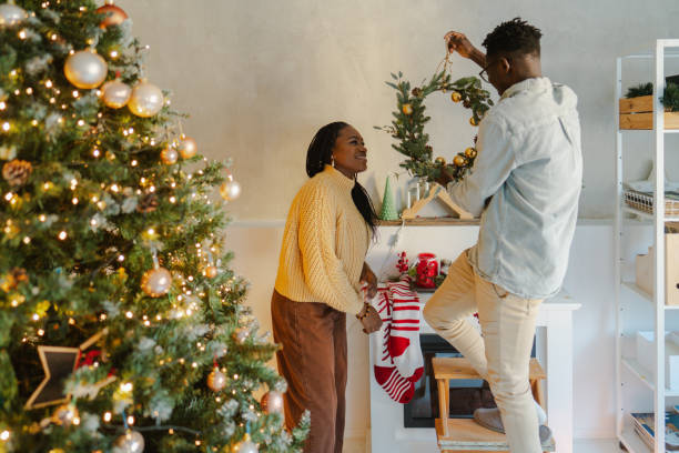 Couple decorating for Christmas Holidays