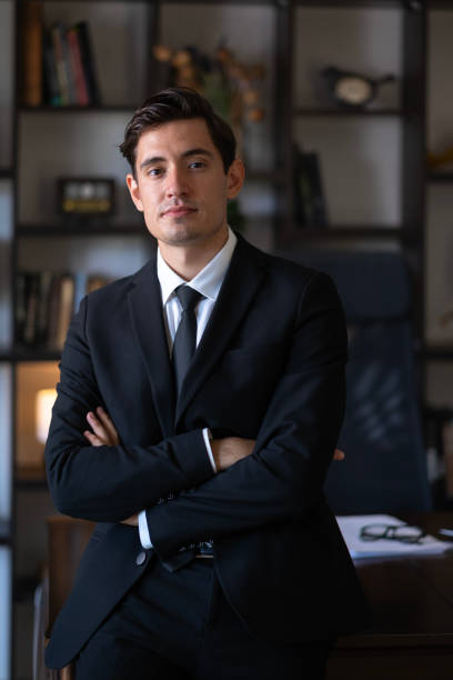 istock Handsome young addict with arms crossed in office looking at camera 2178956574