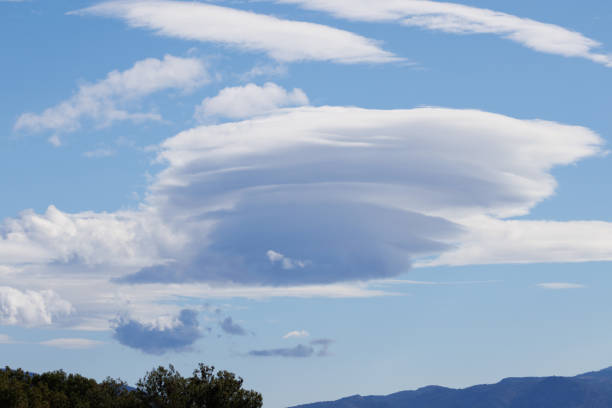 Lenticular clouds on a windy day over the Sierra de Mariola natural park, Alcoy, Spain