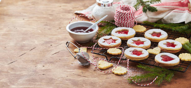 istock Classic Linzer Christmas Cookies with raspberry or strawberry jam on wooden table 2178972583