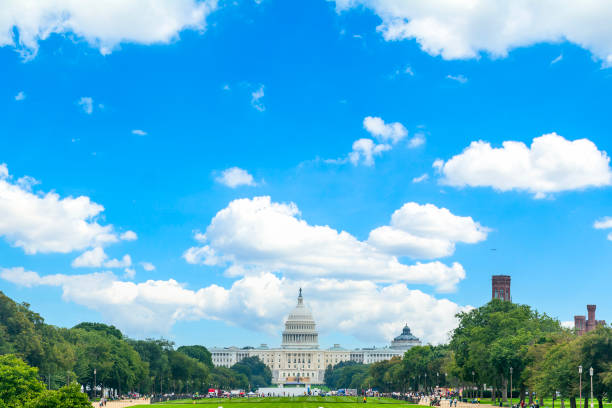 istock The United States Capitol under a blue sky with clouds 2178979167