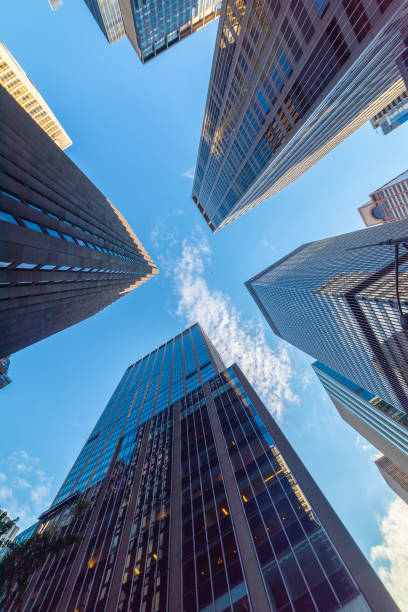 istock Skyscrapers in Manhattan under a blue sky seen from below 2178981401