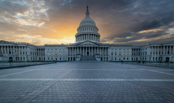 istock Dramatic sky over United States Capitol at sunset 2178982087