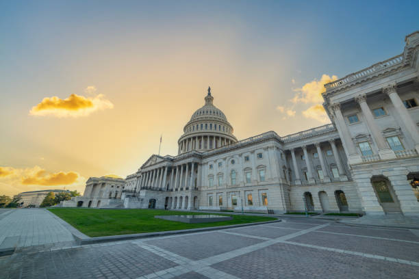 istock United States Capitol under an orange and blue sky at sunset 2178982309