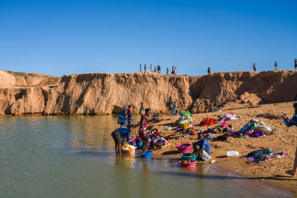 Gentle waters of Indus flow across green landscape. A sweeping wide-angle landscape shot of the Indus River basin. Punjab, Pakistan.