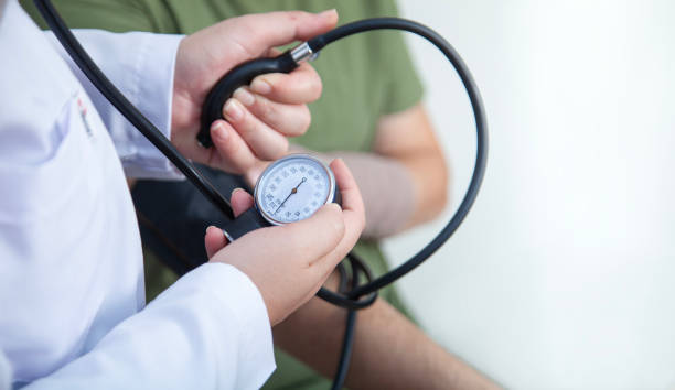 istock Doctor measuring blood pressure 2179005333